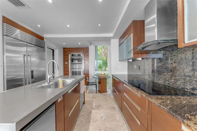 a dining room with furniture a window and a kitchen view