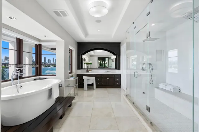 a white bath tub sitting next to a window