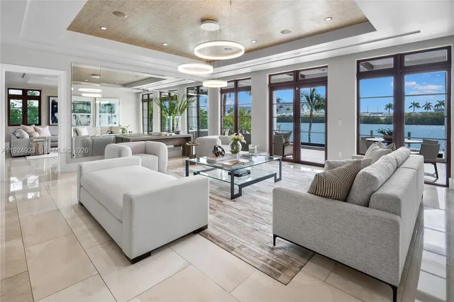 a view of a dining room with furniture wooden floor and chandelier