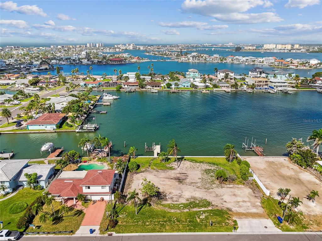 568 Johns Pass Avenue Madeira Beach, FL 33708 - Photo 17 of 36 an aerial view of water body with boats and residential houses with outdoor space