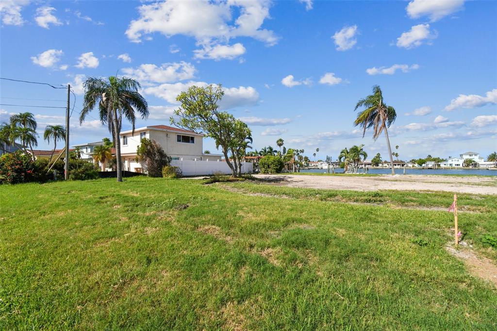 568 Johns Pass Avenue Madeira Beach, FL 33708 - Photo 27 of 36 a front view of a house with garden
