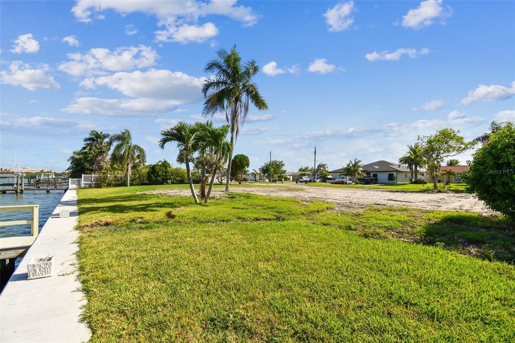 568 Johns Pass Avenue Madeira Beach, FL 33708 - Photo 30 of 36 a view of a swimming pool with an outdoor space and seating area