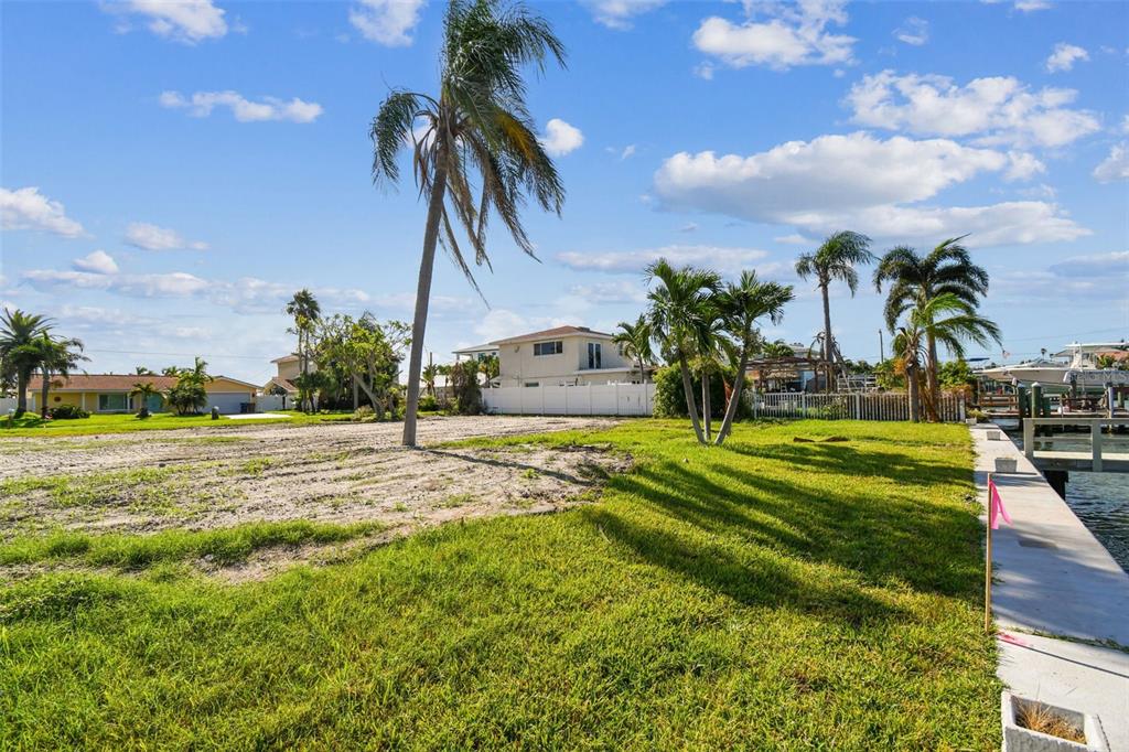 568 Johns Pass Avenue Madeira Beach, FL 33708 - Photo 33 of 36 a view of a swimming pool with a yard