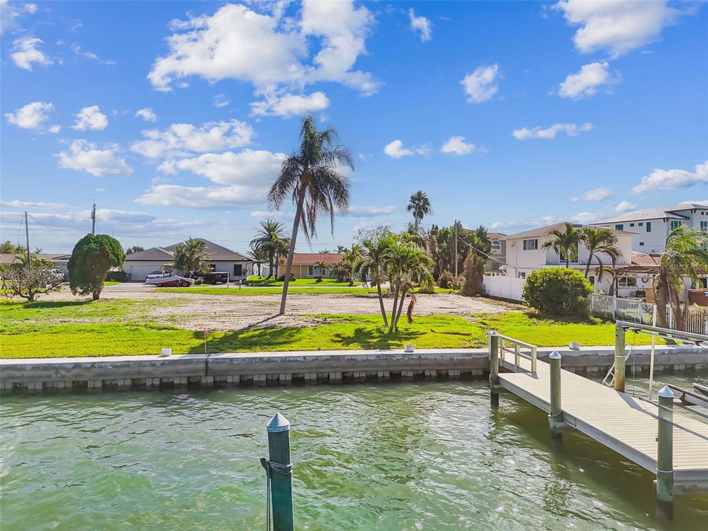 568 Johns Pass Avenue Madeira Beach, FL 33708 - Photo 6 of 36 a view of a lake with a house