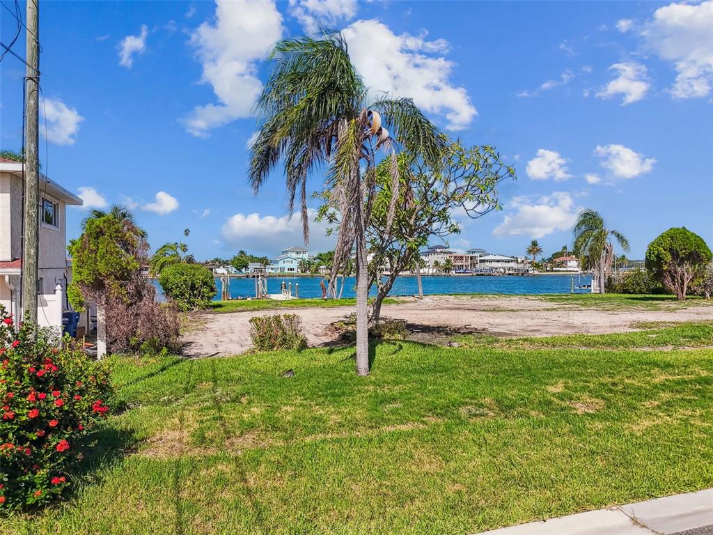 568 Johns Pass Avenue Madeira Beach, FL 33708 - Photo 9 of 36 a view of a garden with an tree