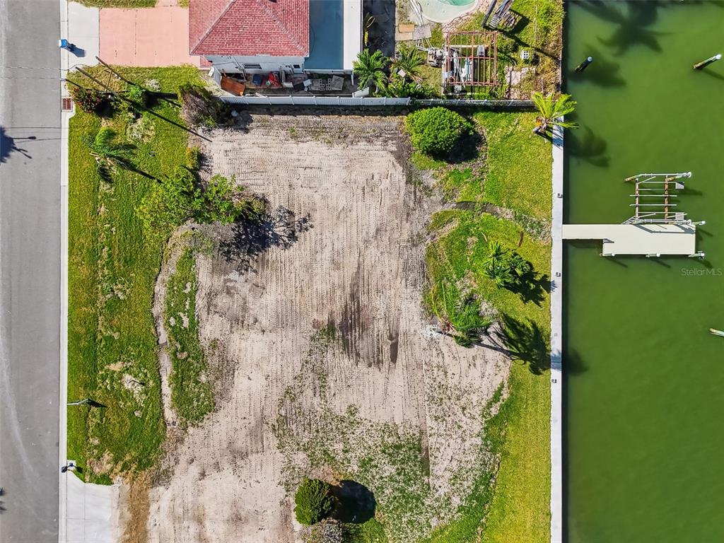 568 Johns Pass Avenue Madeira Beach, FL 33708 - Photo 10 of 36 an aerial view of a house with a yard