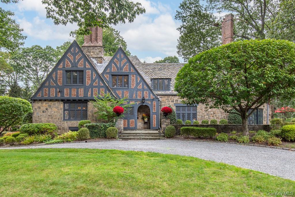 Introducing a magnificently restored Tudor nestled on nearly one acre of landscaped property in Bronxville's Lawrence Park West.