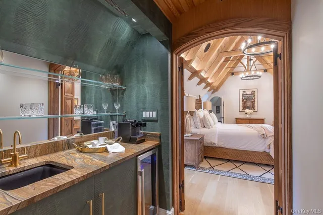 a bathroom with a sink a mirror and shower