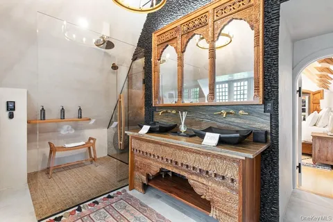 a bathroom with a sink a toilet and bathtub