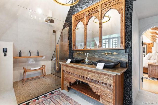 a bathroom with a sink a toilet and bathtub