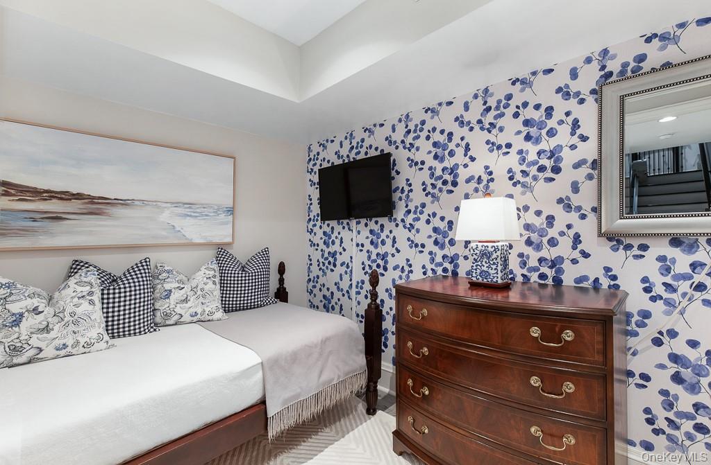 21 Hampshire Road Bronxville, NY 10708 - Photo 35 of 41 a bedroom with a bed and a television