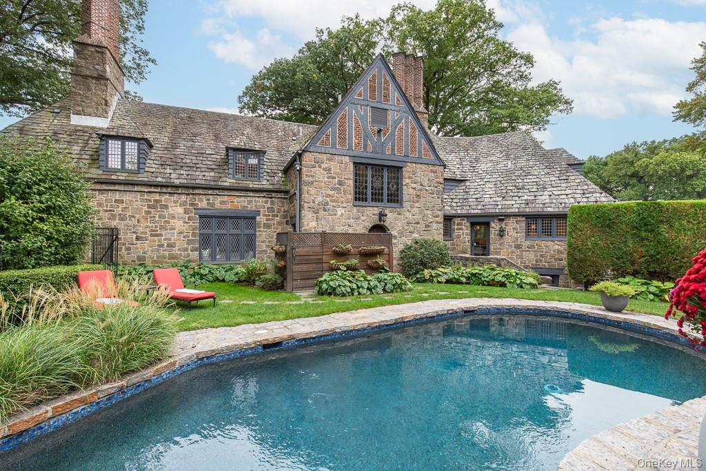 21 Hampshire Road Bronxville, NY 10708 - Photo 38 of 41 a aerial view of a house with swimming pool and a yard