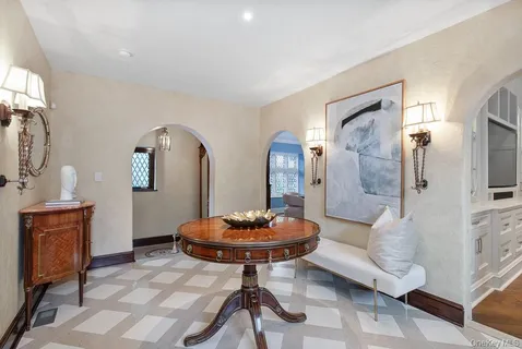 a view of a livingroom with furniture and a chandelier