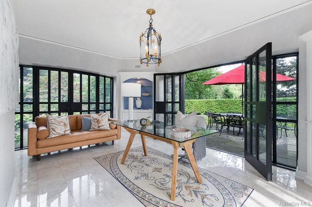 a dining room with furniture and window