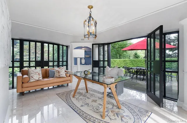 a dining room with furniture and window