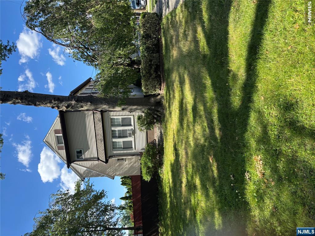 382 Riverside Avenue Rutherford, NJ 07070 - Photo 3 of 29 a view of a swimming pool with a yard