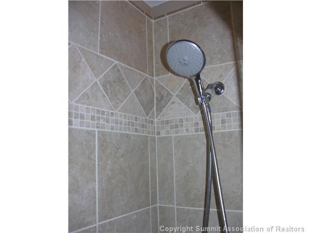 110 Evergreen Road, Unit 202 Dillon, CO 80435 - Photo 9 of 10 a bathroom with a shower and a mirror