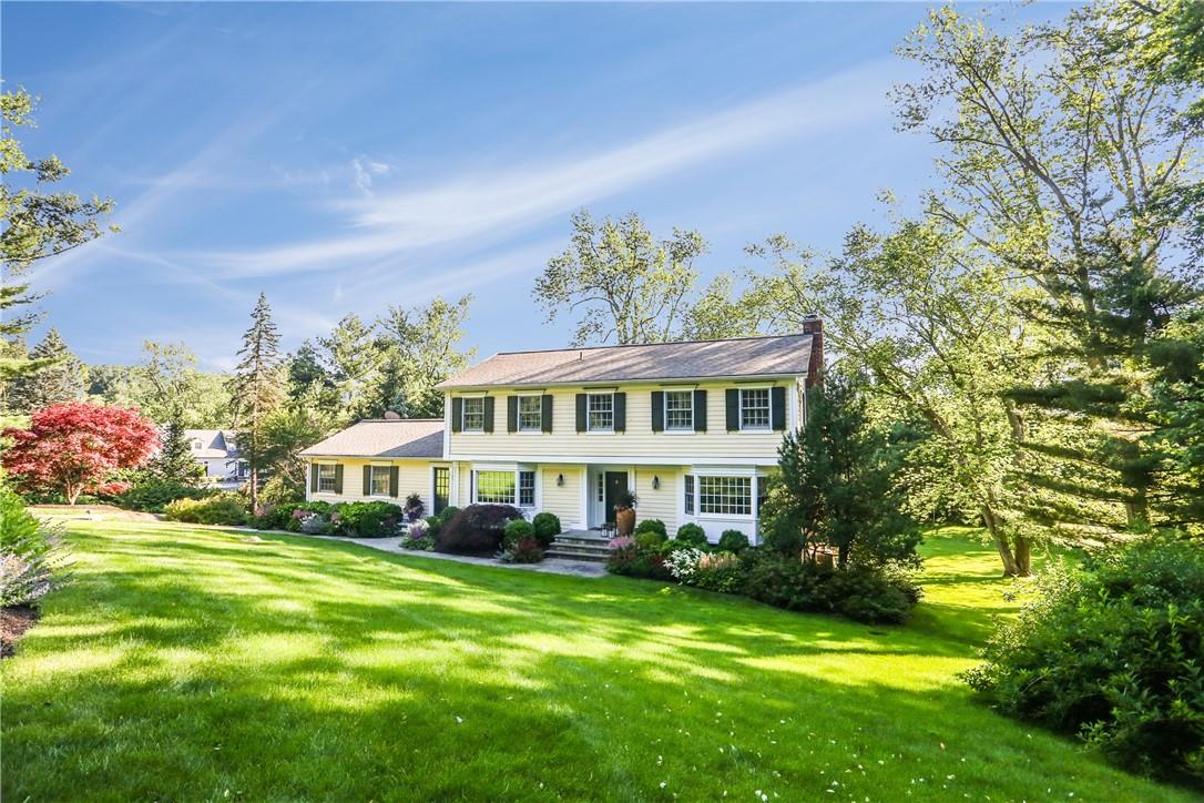 3 Sterling Road South Armonk, NY 10504 - Photo 1 of 1 a front view of house with yard and trees in the background