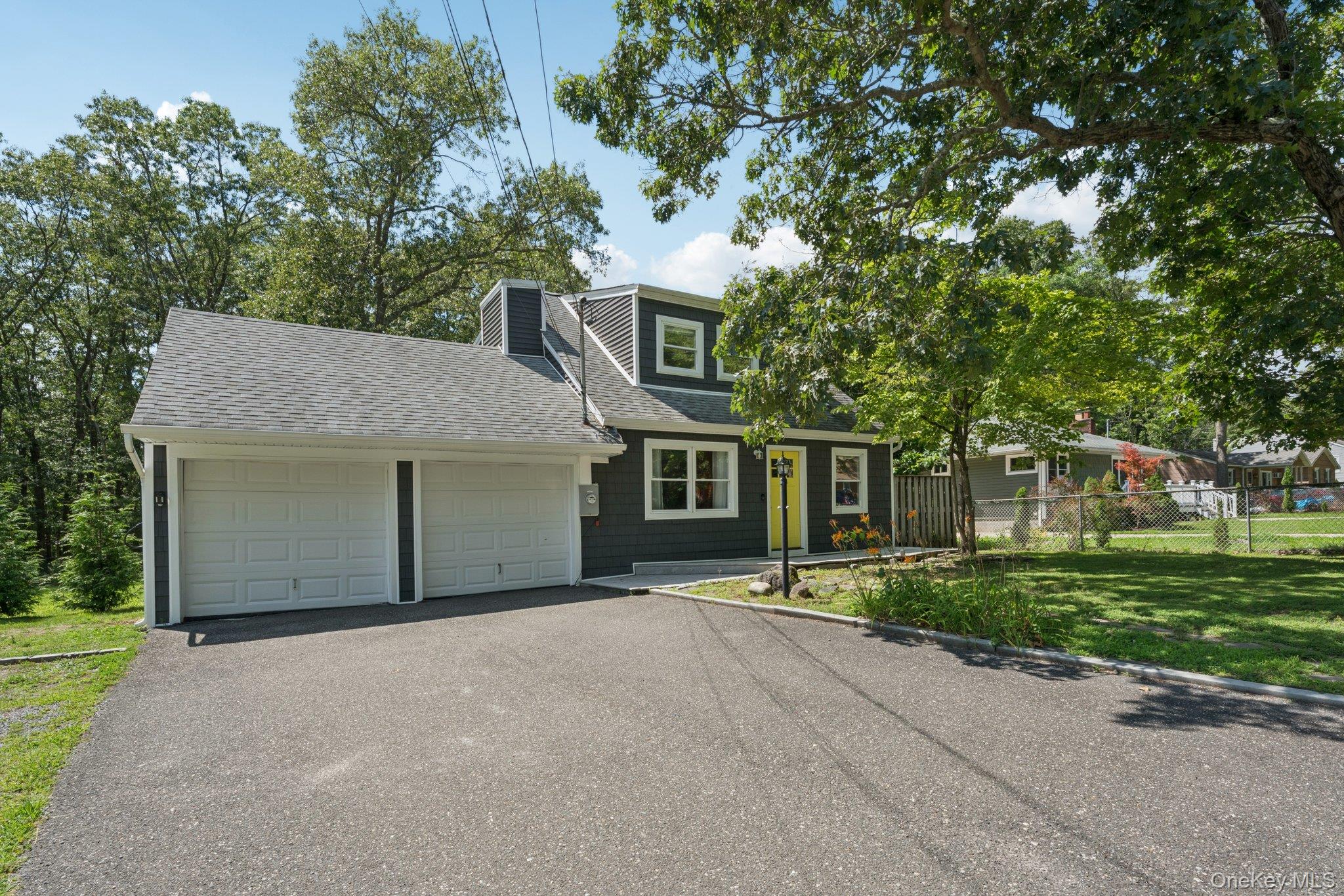 front view of a house with a garden