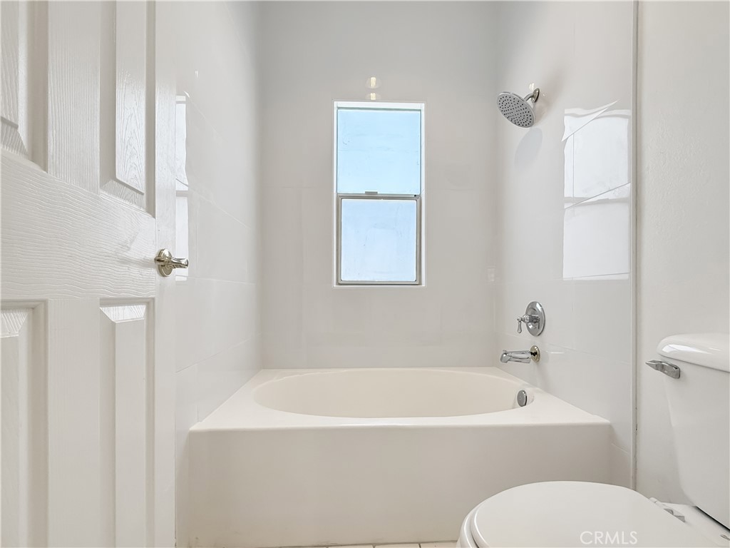 255 North Michigan Avenue, Unit 4 Pasadena, CA 91106 - Photo 18 of 20 a white bath tub sitting next to a white toilet