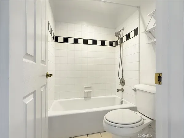 a bathroom with a toilet and a bathtub