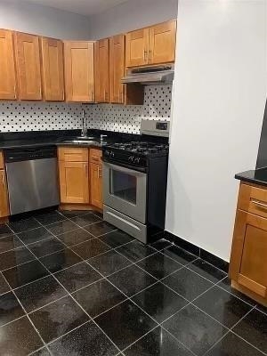 1503 76th Street, Unit 2 North Bergen, NJ 07047 - Photo 6 of 11 a kitchen with a sink a stove and cabinets