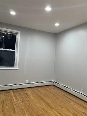 1503 76th Street, Unit 2 North Bergen, NJ 07047 - Photo 7 of 11 an empty room with a window