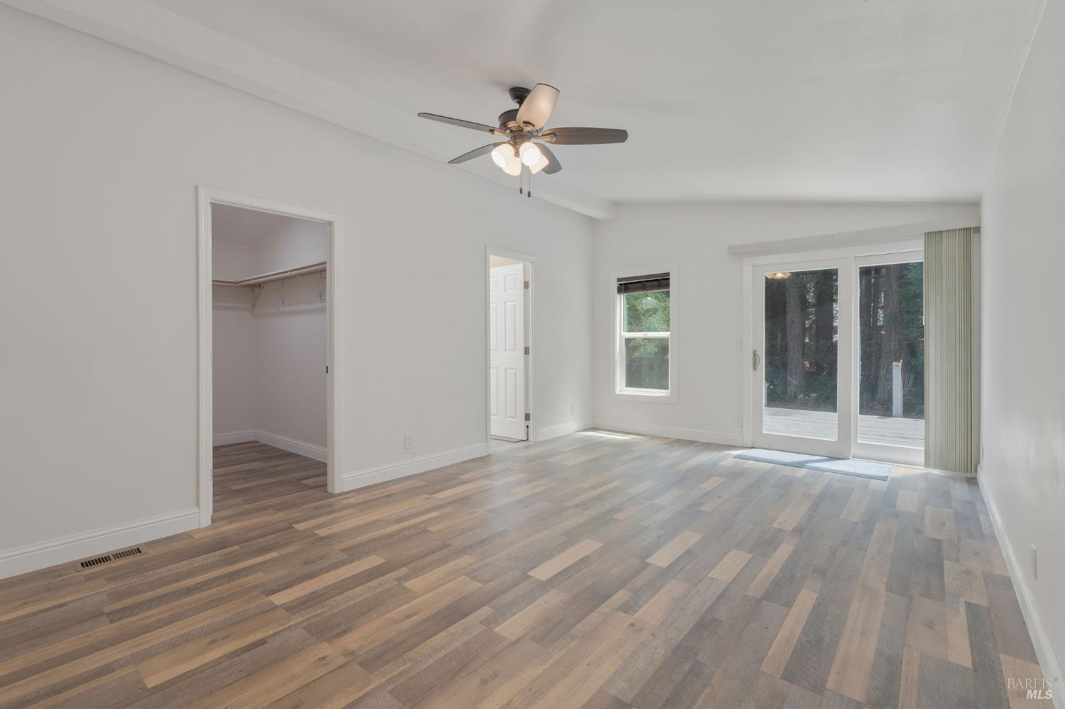 38350 Old Stage Road Gualala, CA 95445 - Photo 15 of 31 Primary Suite with walk in closet and opening to private deck.