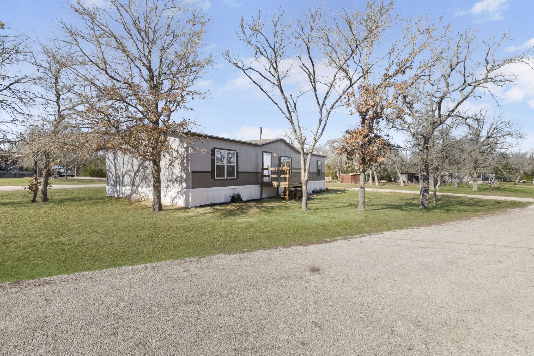 101 Hill Loop Road Somerville, TX 77879 - Photo 11 of 45 a front view of a house with a yard and trees
