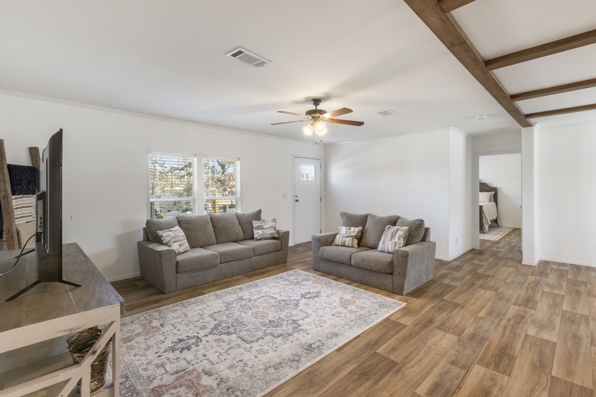 101 Hill Loop Road Somerville, TX 77879 - Photo 16 of 45 a living room with furniture and a flat screen tv