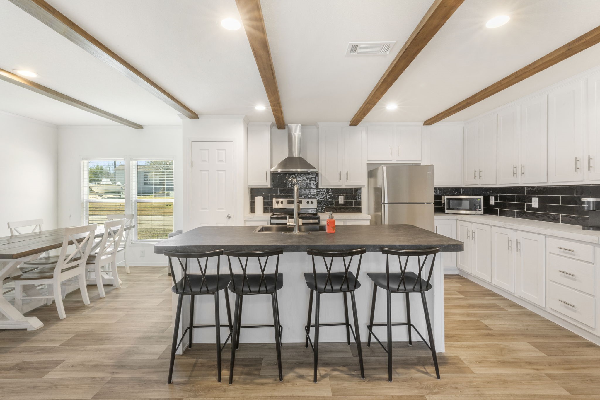 101 Hill Loop Road Somerville, TX 77879 - Photo 18 of 45 a view of a dining room with furniture and wooden floor