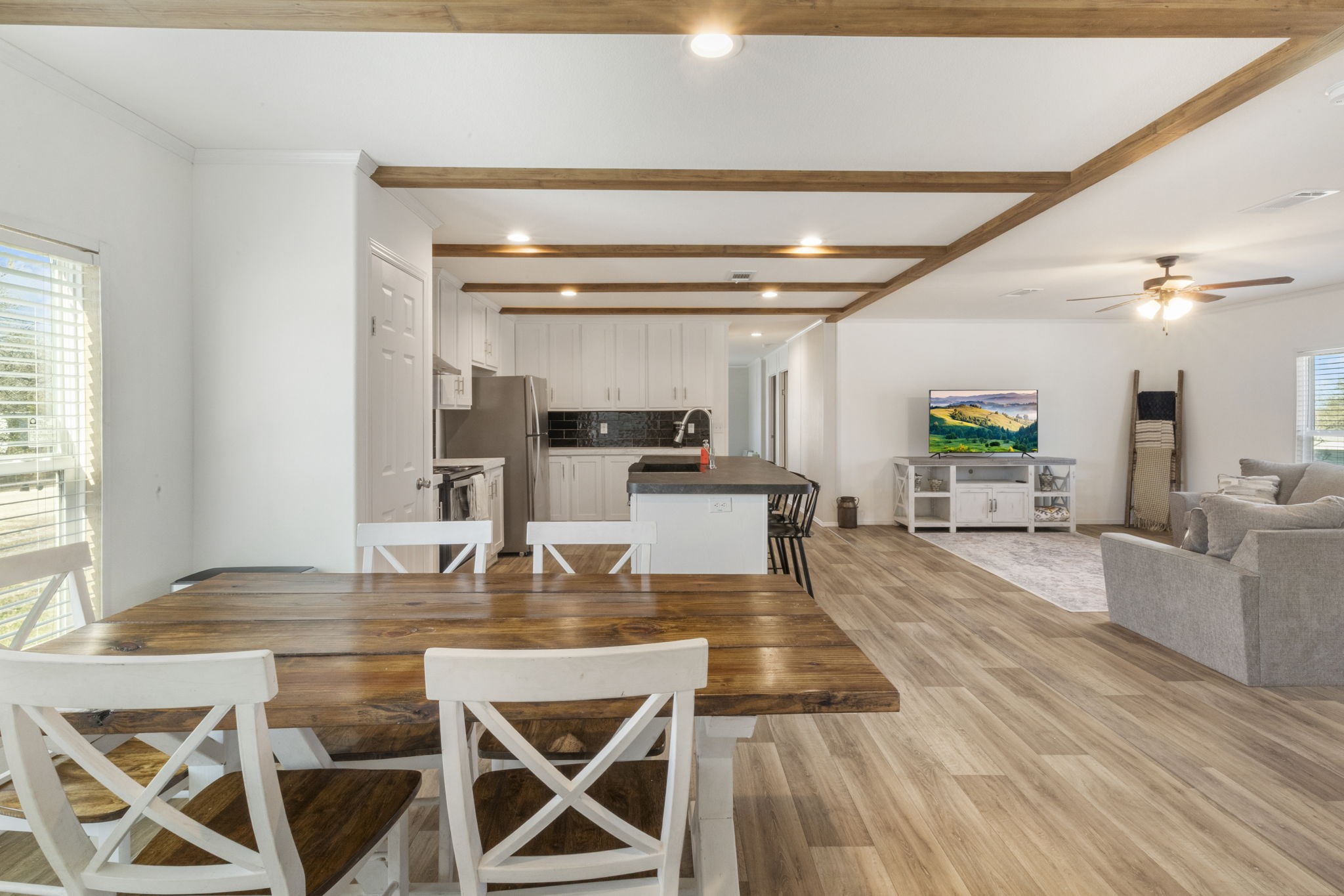 101 Hill Loop Road Somerville, TX 77879 - Photo 28 of 45 a kitchen with stainless steel appliances kitchen island granite countertop a sink and cabinets