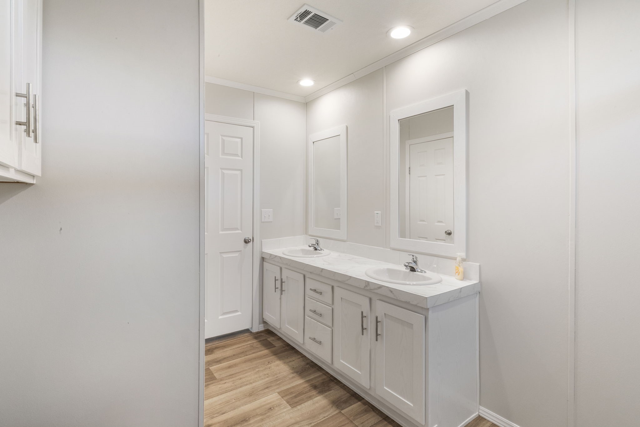 101 Hill Loop Road Somerville, TX 77879 - Photo 33 of 45 a bathroom with a double vanity sink and mirror