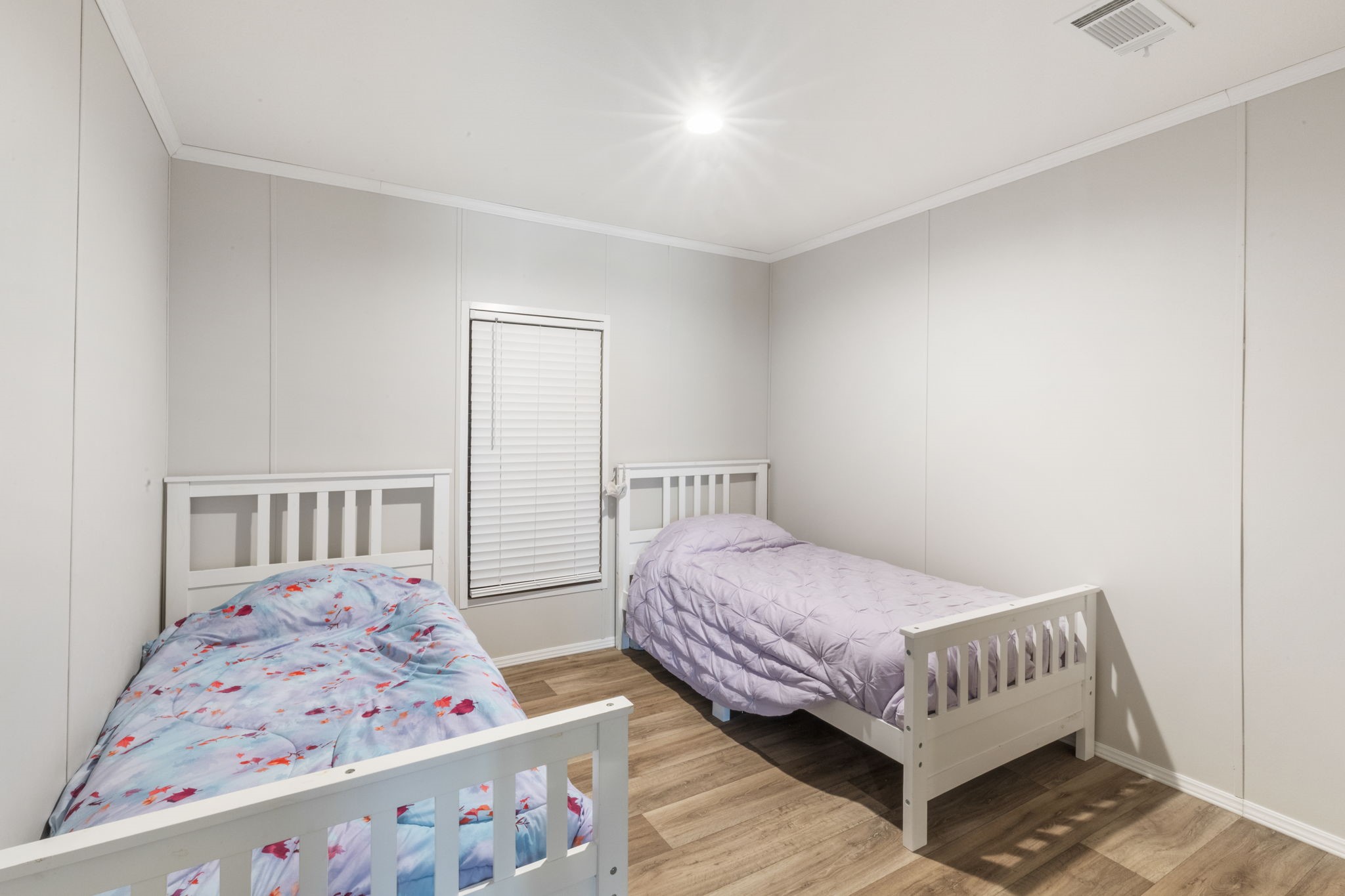 101 Hill Loop Road Somerville, TX 77879 - Photo 34 of 45 a bedroom with a bed and wooden floor