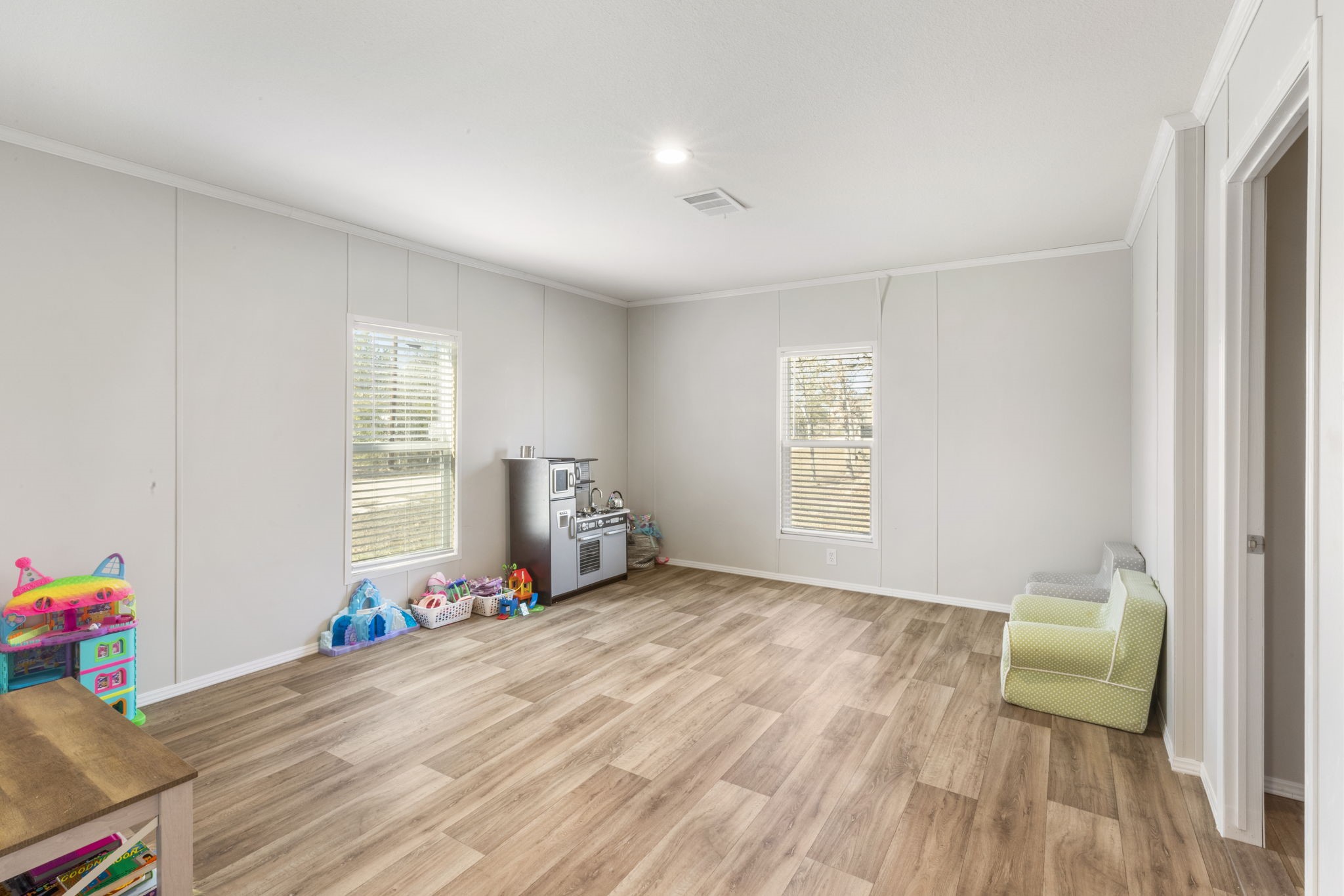 101 Hill Loop Road Somerville, TX 77879 - Photo 37 of 45 a view of room with toys and wooden floor