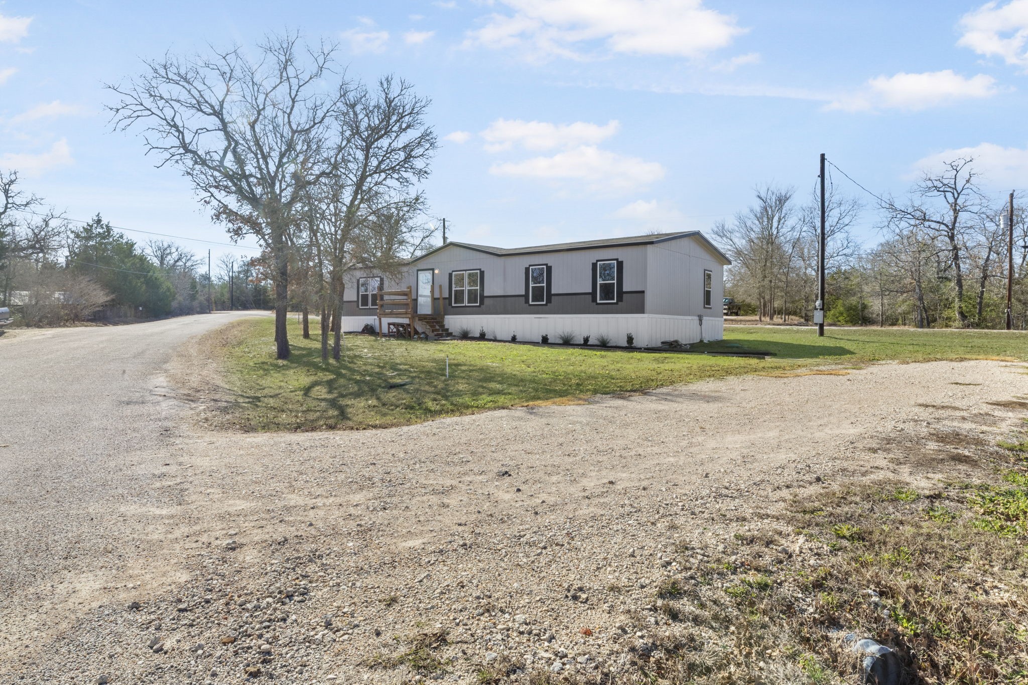 101 Hill Loop Road Somerville, TX 77879 - Photo 10 of 45 a big house with a big yard and large trees