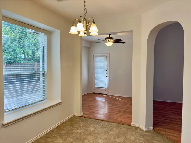 a view of a chandelier and window in a room