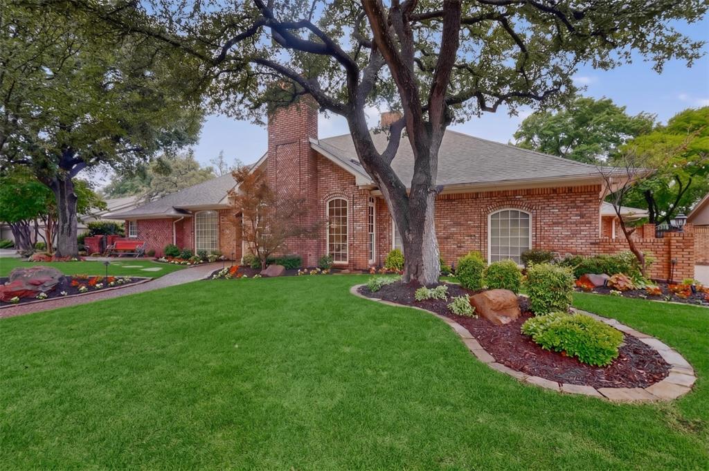 2405 Wing Point Lane Plano, TX 75093 - Photo 2 of 39 a front view of house with yard and green space