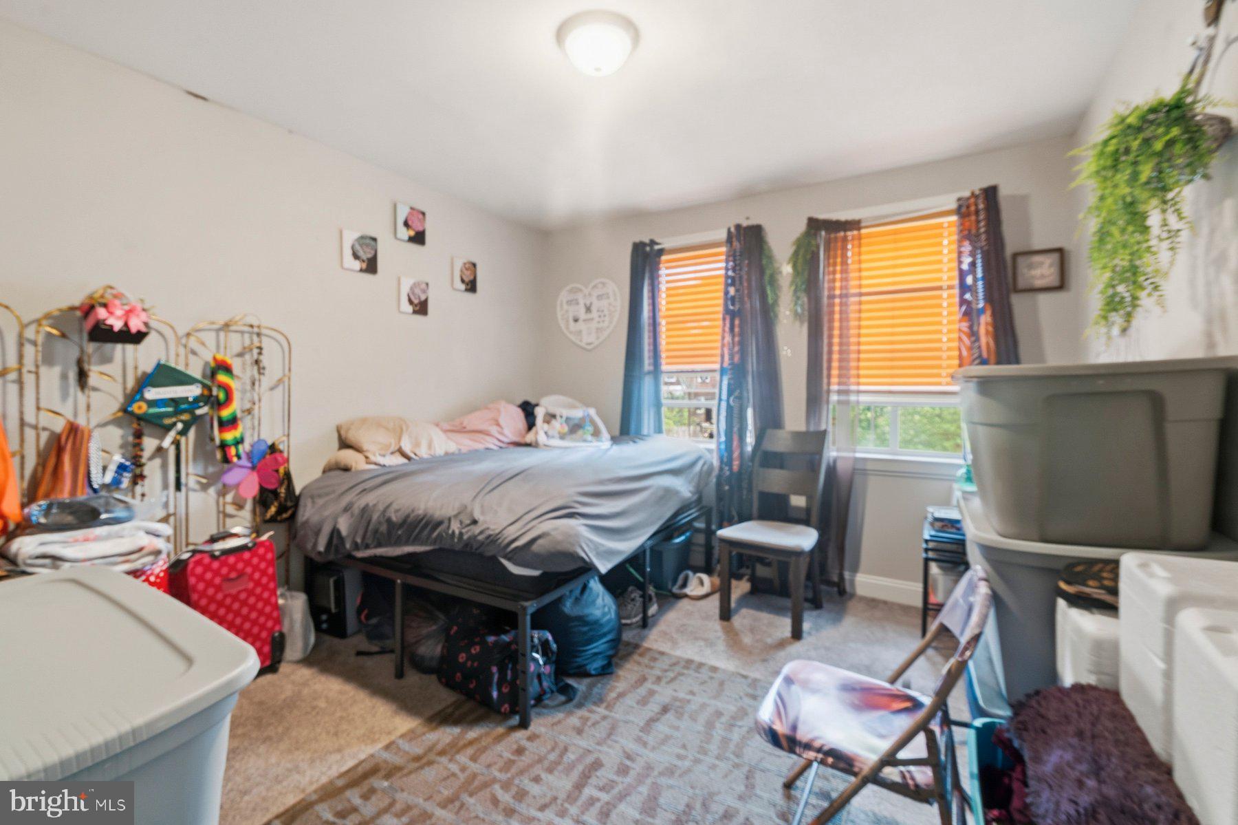 4931 Brookwood Road Baltimore, MD 21225 - Photo 7 of 25 a bedroom with a bed and a window