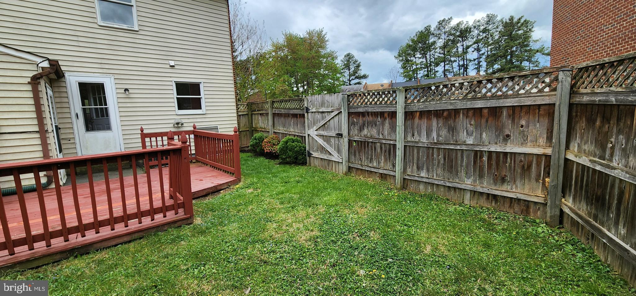 Fenced in rear with deck.