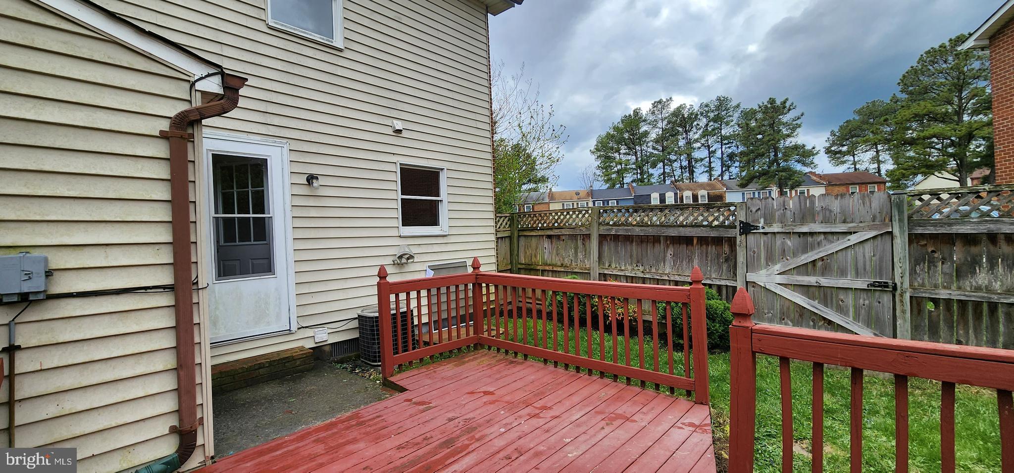 Deck with fence in lovely backyard!