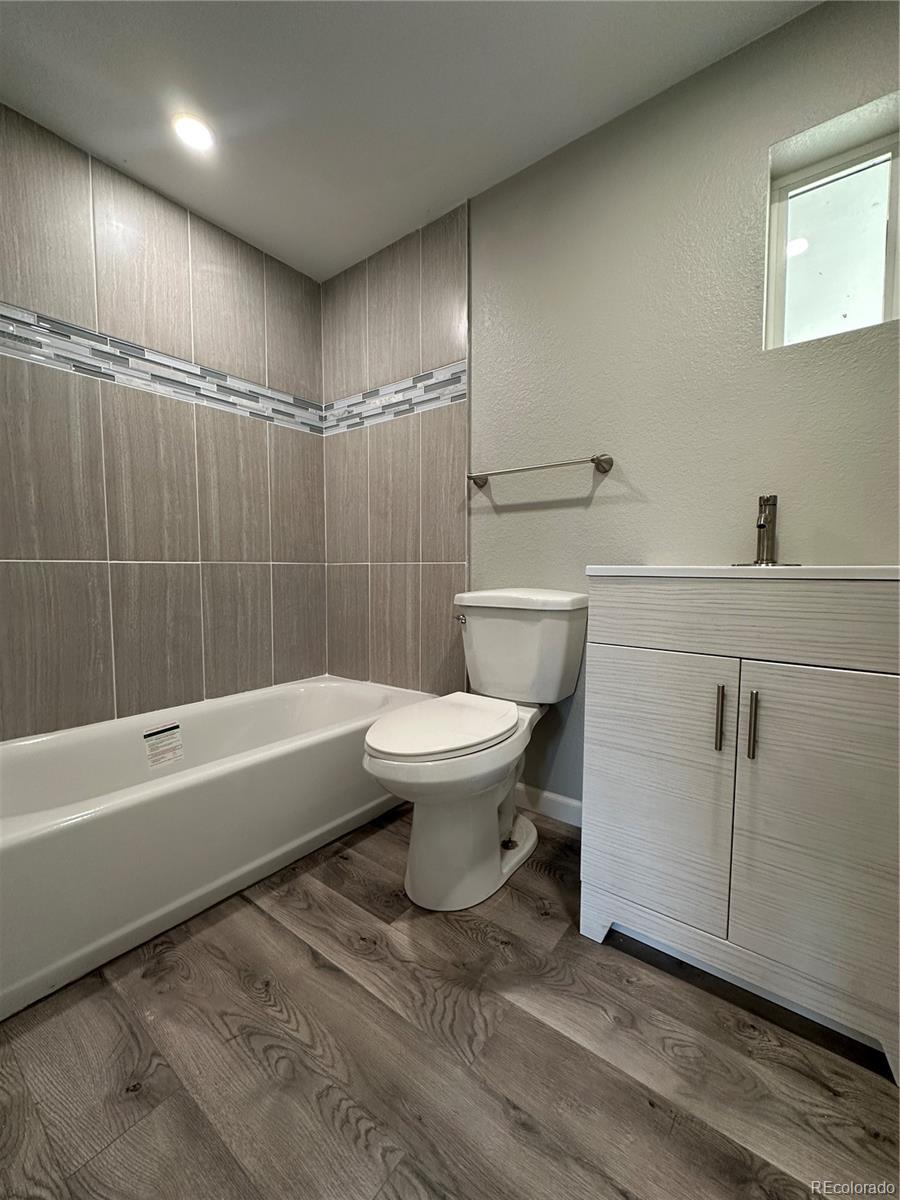 Undisclosed Address Pueblo, CO 81006 - Photo 12 of 27 a bathroom with a toilet a sink and bathtub