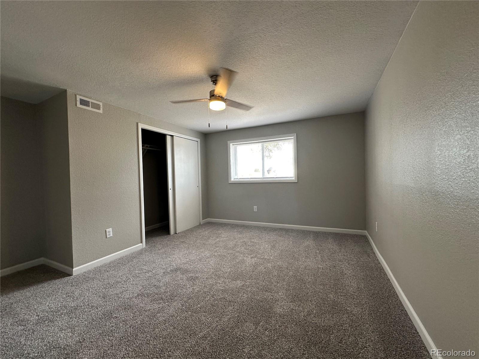 Undisclosed Address Pueblo, CO 81006 - Photo 16 of 27 an empty room with windows and closet