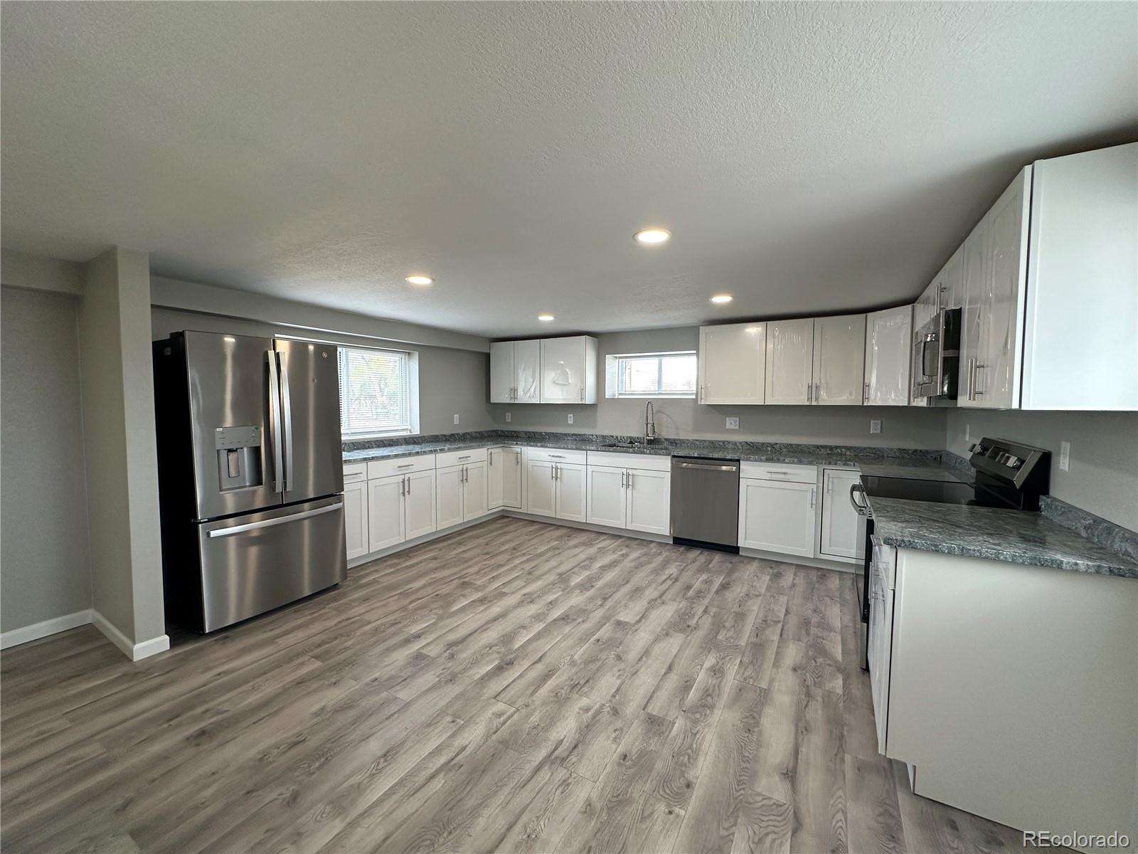 Undisclosed Address Pueblo, CO 81006 - Photo 6 of 27 a large kitchen with a lot of counter space and stainless steel appliances