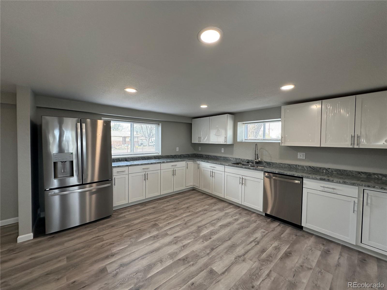 Undisclosed Address Pueblo, CO 81006 - Photo 7 of 27 a large kitchen with cabinets and stainless steel appliances
