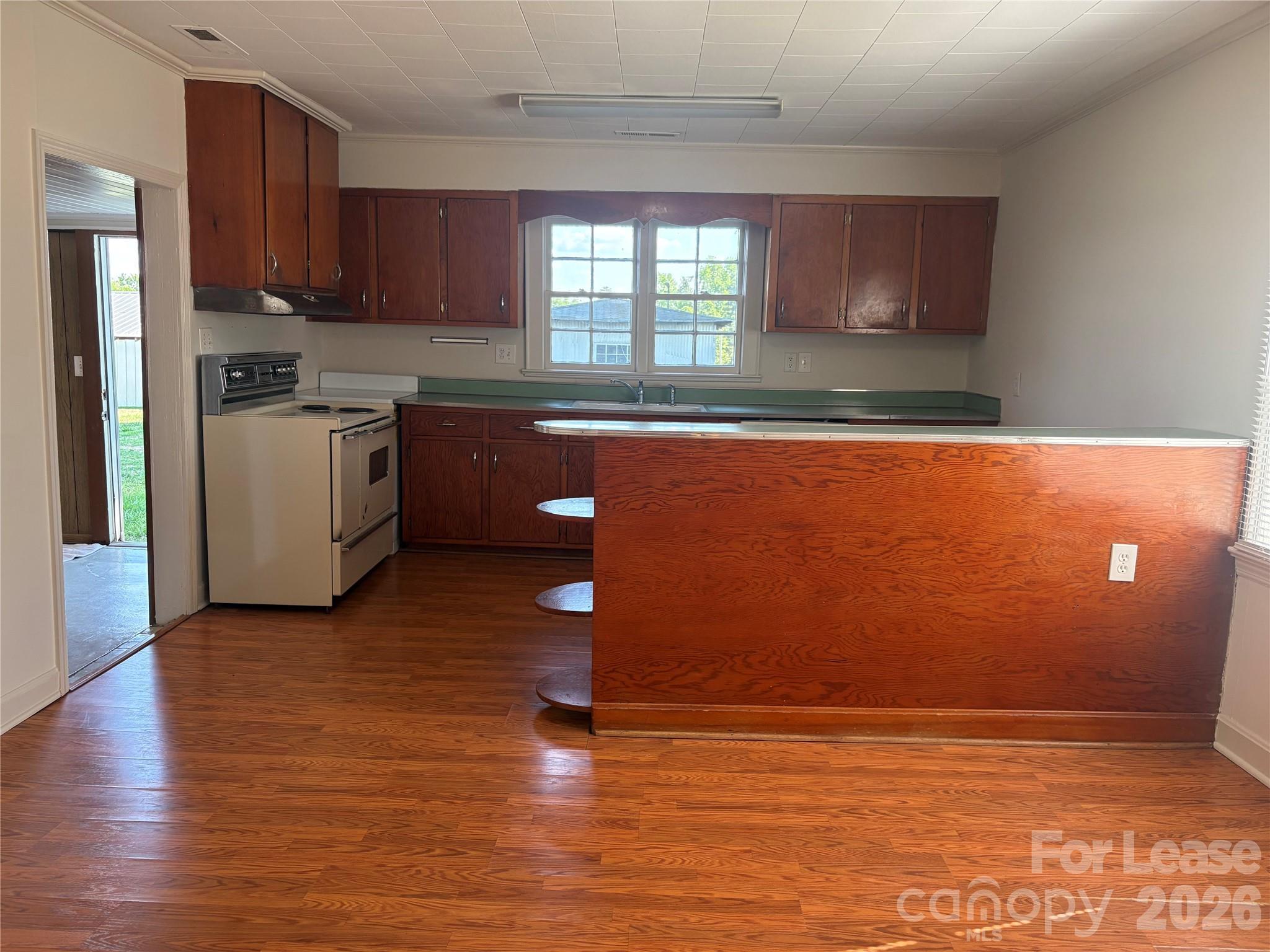 6625 Long Road Matthews, NC 28104 - Photo 7 of 21 a view of kitchen with wooden floor and electronic appliances