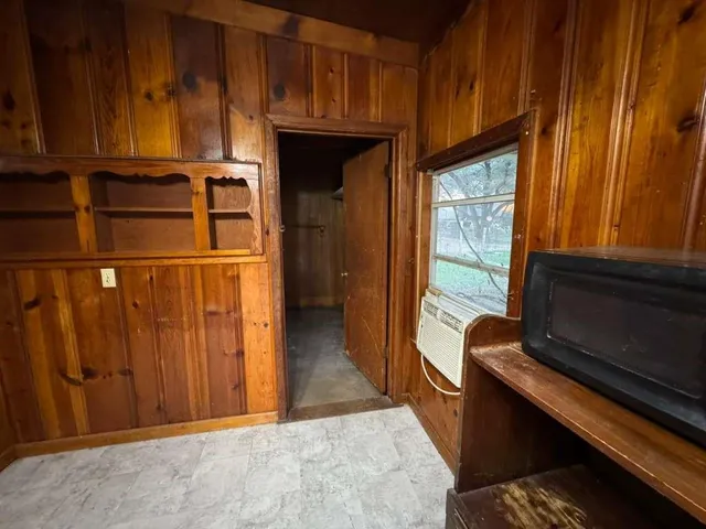 a kitchen with a refrigerator and window