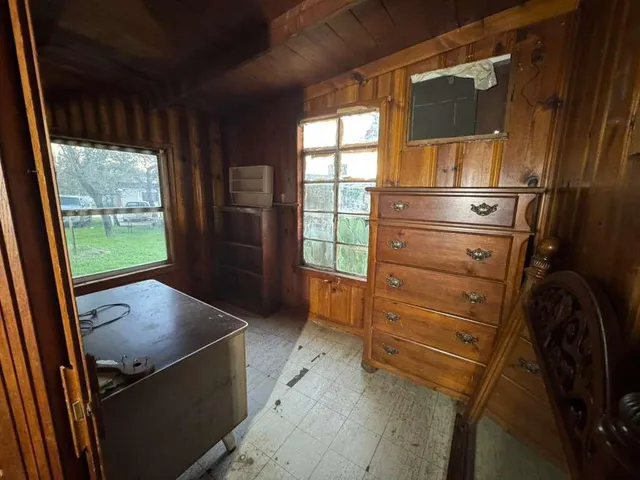 a bathroom with a sink a toilet a tub and shower