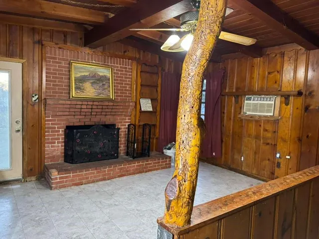 a view of an empty room with a fireplace