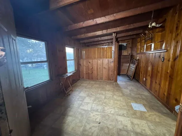 a view of a livingroom with furniture and a fireplace